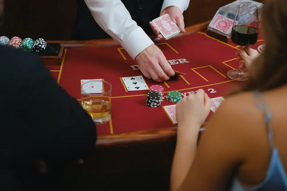 Image of a dealer dealing cards during a game.