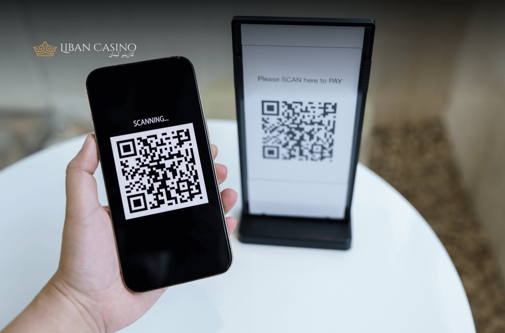 Mobile phone scanning a QR to make a payment.