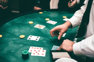 A dealer deals cards on a blackjack table